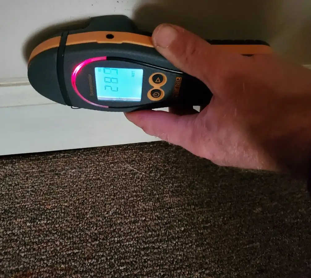 Moisture detection at baseboard during Storm Damage Restoration in East Cocalico